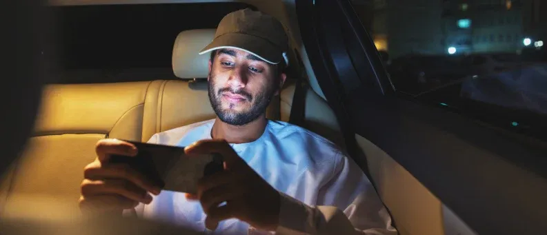 man watching show on phone